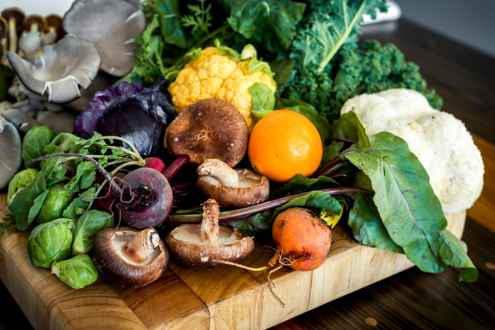 Raw vegetables on wooden block