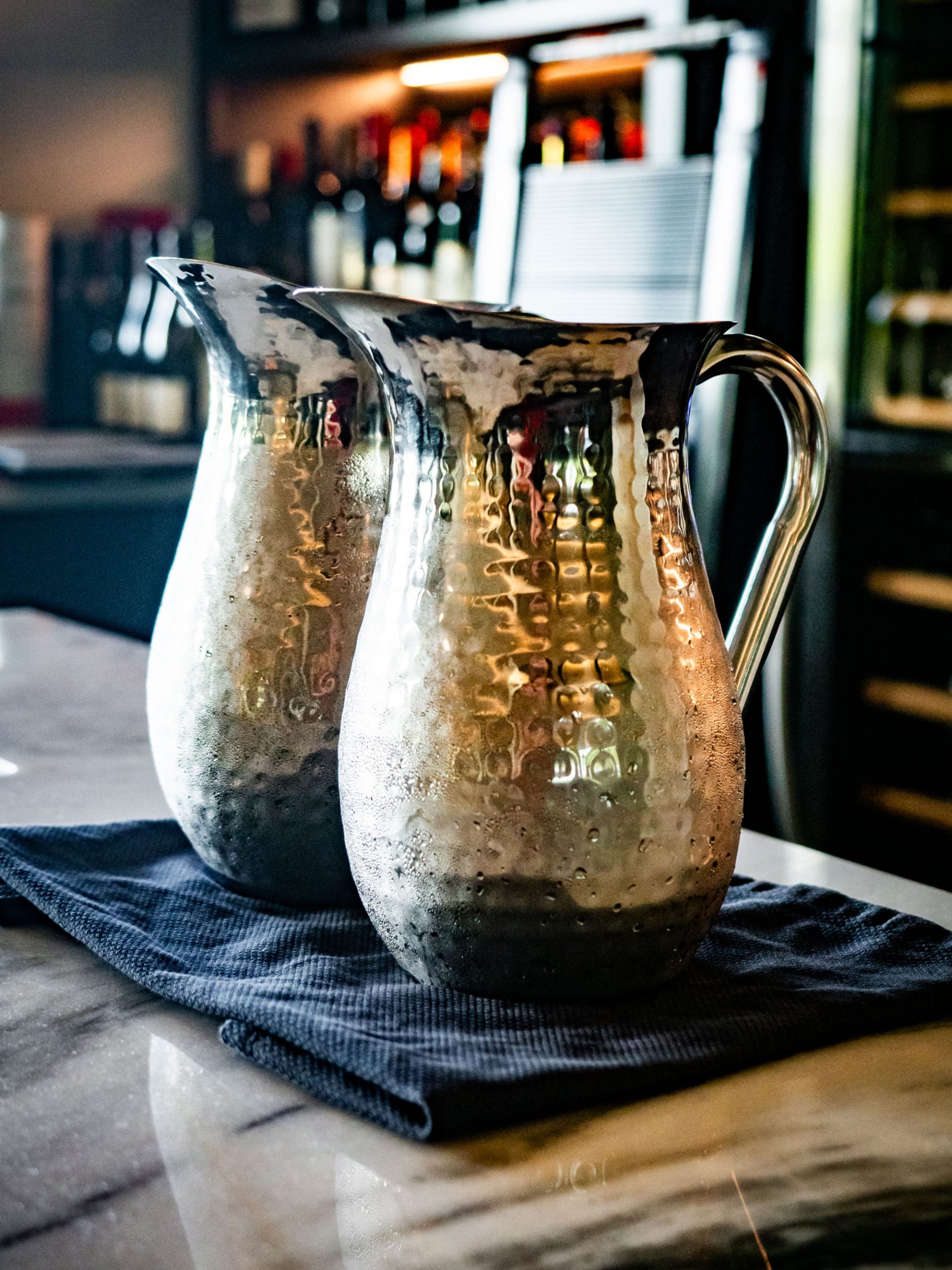 Drink pitchers sitting on bar countertop